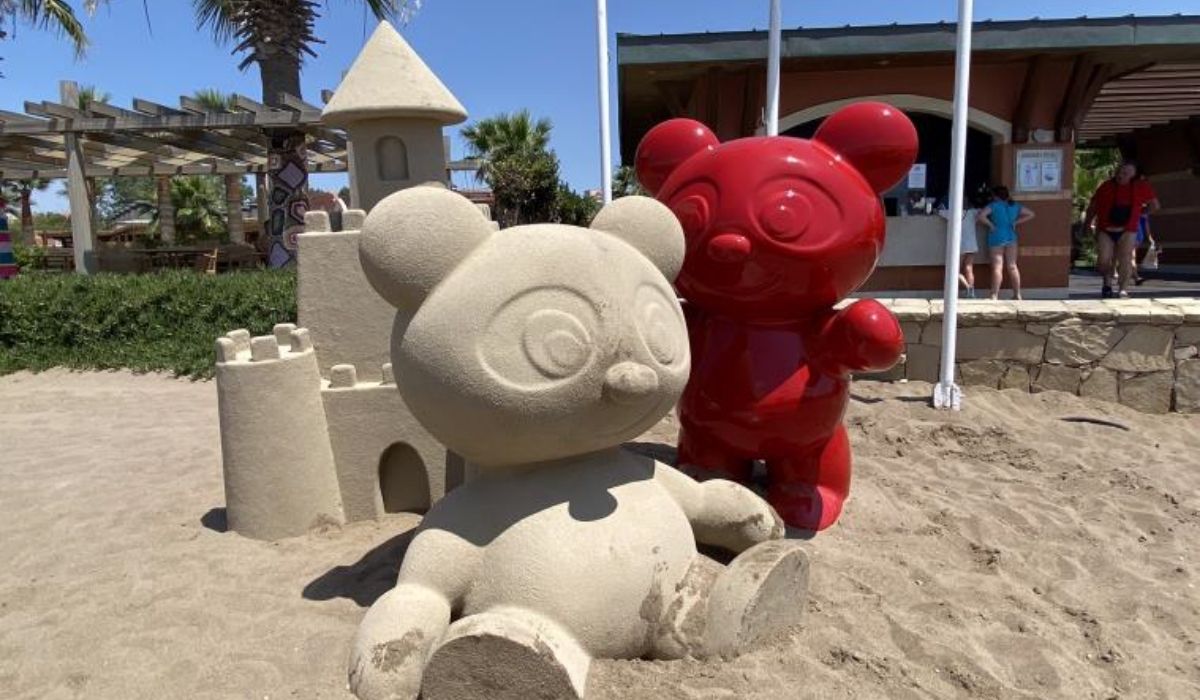 Playful bear sculptures and sandcastle fabricated by Alice Scenic Studios for an outdoor attraction