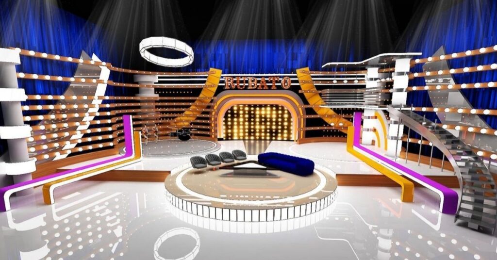 Television studio set with bright show lighting, curved staircases and feature walls for an entertainment program